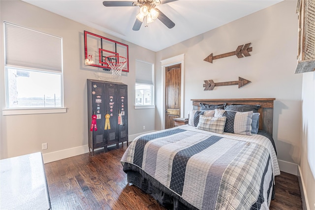 bedroom with multiple windows, ceiling fan, and dark hardwood / wood-style floors