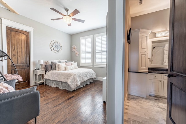 bedroom with ceiling fan and dark hardwood / wood-style flooring