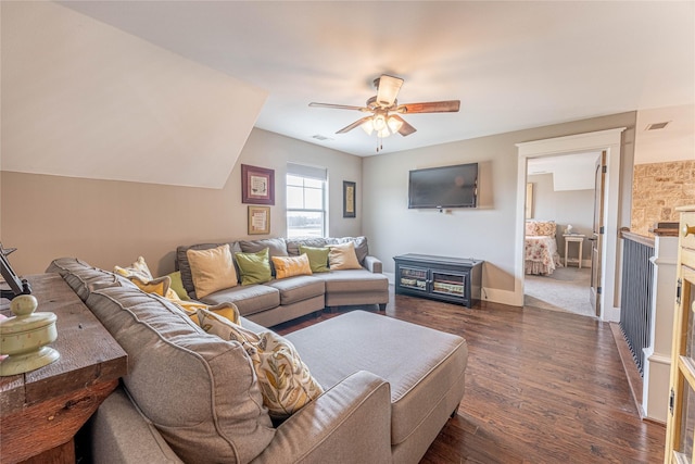 living room with ceiling fan, a fireplace, and dark hardwood / wood-style floors