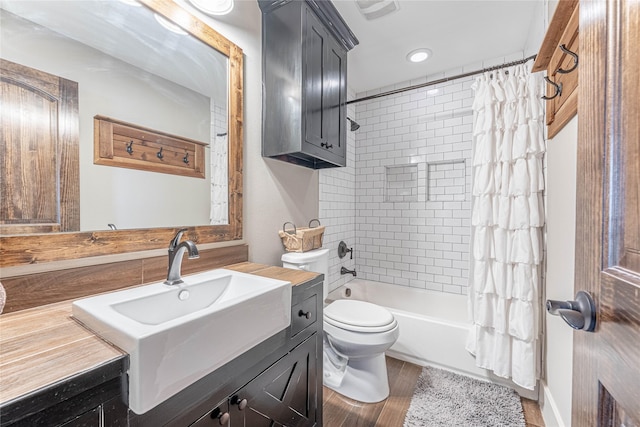 full bathroom with shower / bath combo, vanity, and toilet