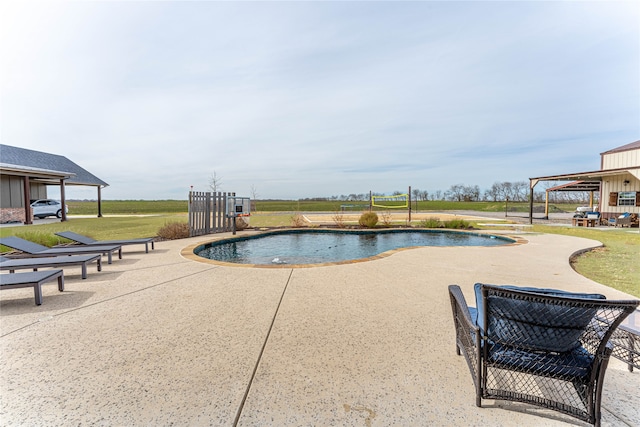 view of swimming pool featuring a patio area