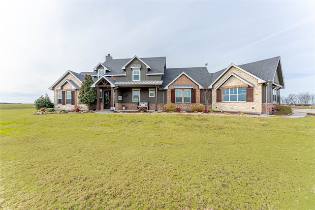 craftsman house featuring a front lawn