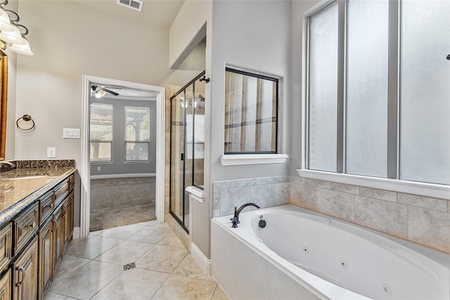 bathroom with tile patterned flooring, vanity, ceiling fan, and independent shower and bath