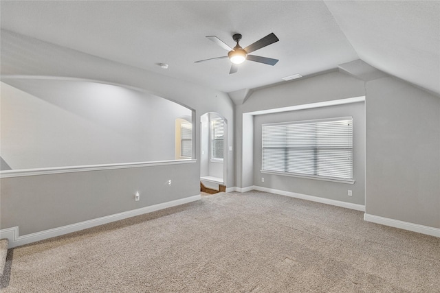 interior space featuring carpet, ceiling fan, and lofted ceiling