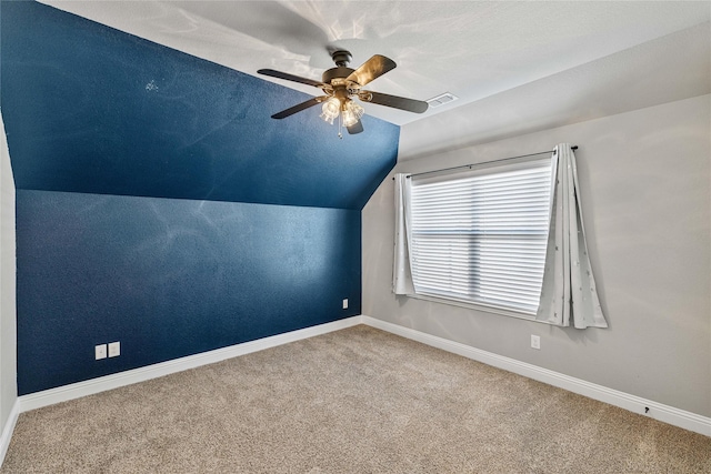 additional living space featuring carpet, ceiling fan, and lofted ceiling