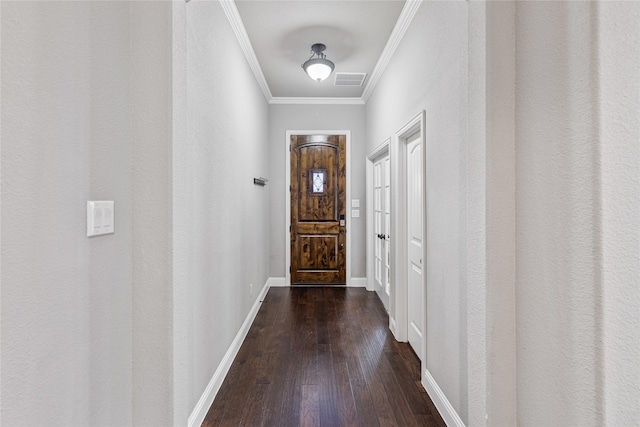 doorway to outside featuring dark hardwood / wood-style floors and crown molding