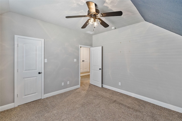 unfurnished bedroom featuring carpet flooring, ceiling fan, and lofted ceiling