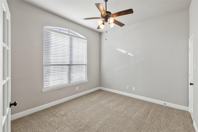 carpeted empty room with ceiling fan