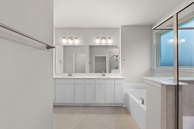 full bath featuring a shower with shower door, a garden tub, double vanity, and a sink