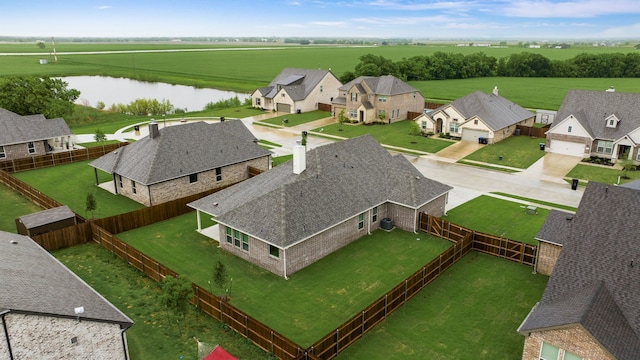 bird's eye view with a residential view and a water view