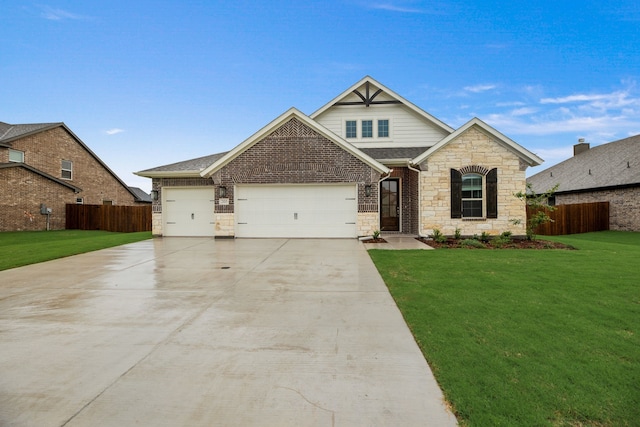 craftsman-style house featuring a garage, fence, and a front yard
