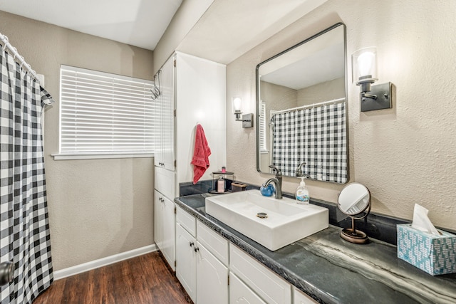 bathroom with vanity and wood-type flooring