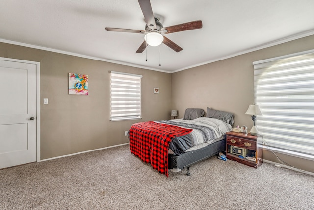 carpeted bedroom with ceiling fan and crown molding