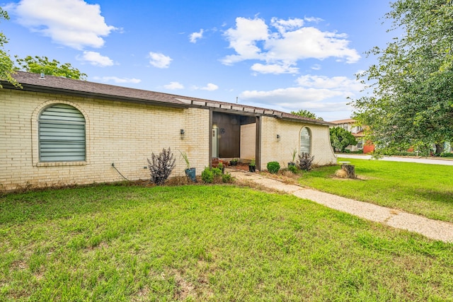 ranch-style house with a front lawn