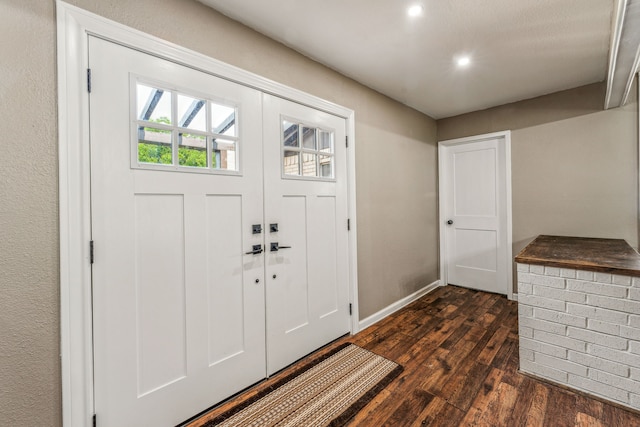 entrance foyer with dark hardwood / wood-style flooring