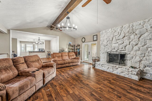 living room with a fireplace, lofted ceiling with beams, a textured ceiling, and dark hardwood / wood-style floors