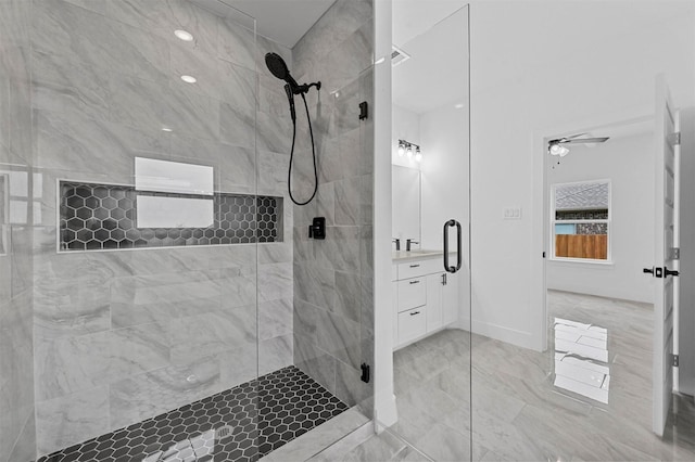 bathroom featuring walk in shower and vanity