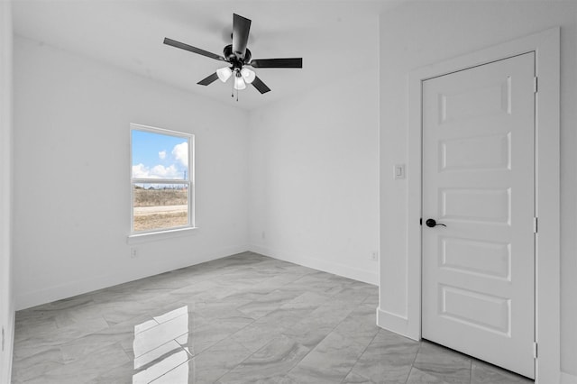 spare room featuring ceiling fan