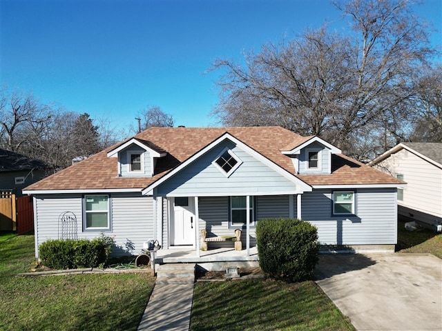 view of front of house featuring a front yard and a porch