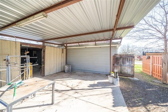 view of patio / terrace with an outbuilding