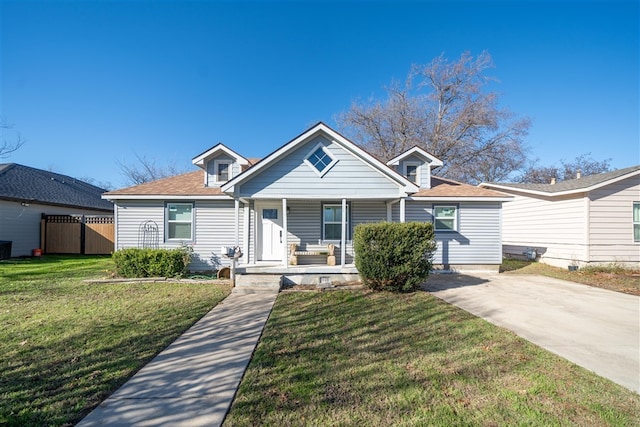 bungalow-style house with a front lawn and a porch