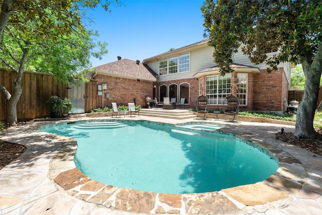 view of swimming pool featuring a patio