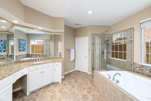 bathroom with vanity and separate shower and tub