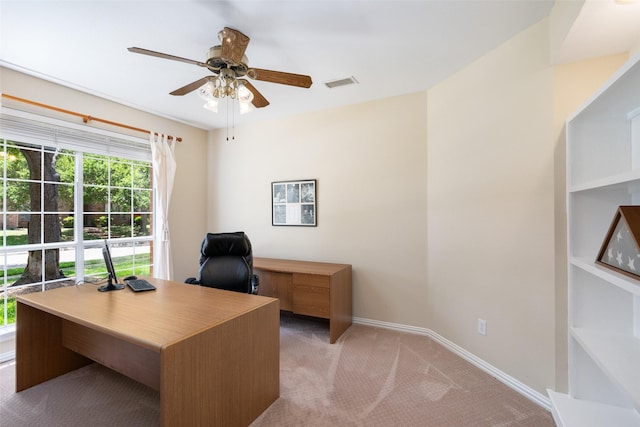 home office featuring ceiling fan and light carpet