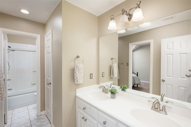 bathroom with bathing tub / shower combination, tile patterned flooring, and vanity