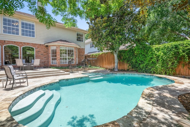 view of pool featuring a patio