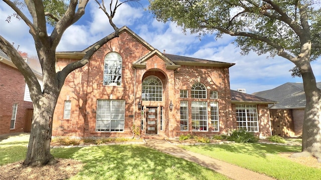 view of property with a front lawn