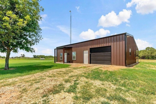 garage featuring a yard