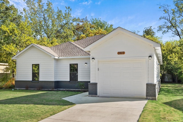 ranch-style house featuring a garage and a front lawn