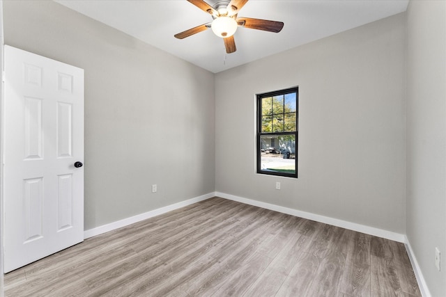 unfurnished room featuring light wood-type flooring and ceiling fan