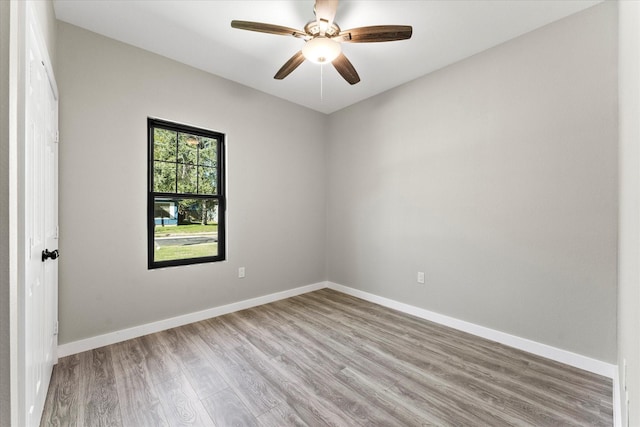 unfurnished room with ceiling fan and light wood-type flooring