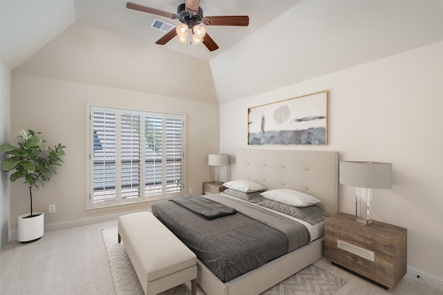 carpeted bedroom featuring vaulted ceiling and ceiling fan