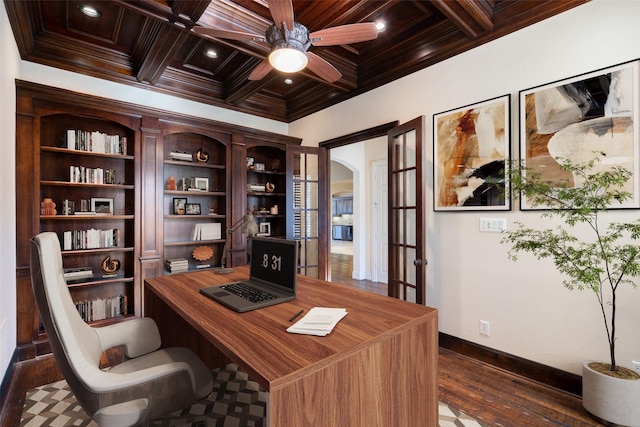 office with ceiling fan, coffered ceiling, ornamental molding, dark hardwood / wood-style flooring, and beamed ceiling