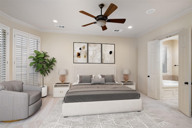 bedroom with crown molding, ceiling fan, ensuite bathroom, and light carpet