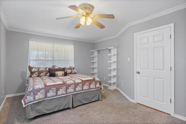 bedroom featuring crown molding, carpet floors, and ceiling fan