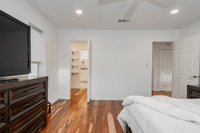 bedroom featuring visible vents, recessed lighting, baseboards, and wood finished floors