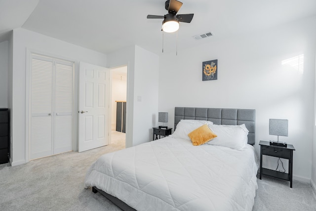 bedroom featuring visible vents, a ceiling fan, a closet, carpet floors, and baseboards