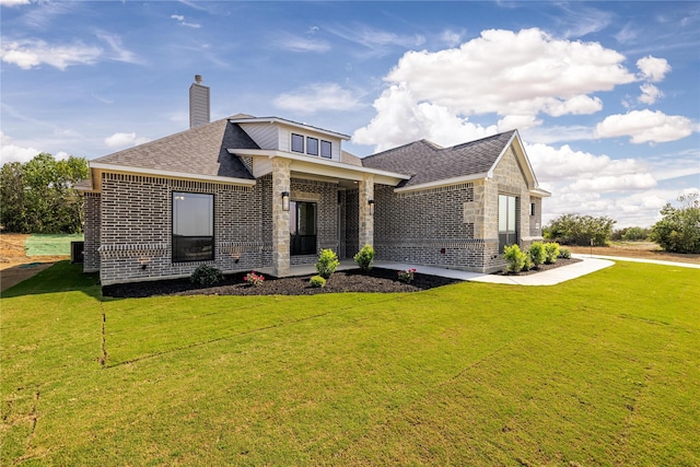 view of front of home with a front yard