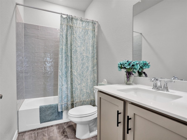 full bathroom with vanity, toilet, and shower / tub combo