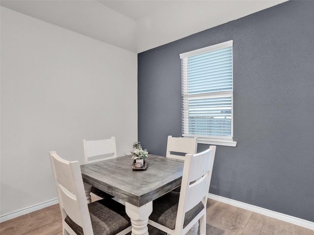 dining area with light hardwood / wood-style flooring