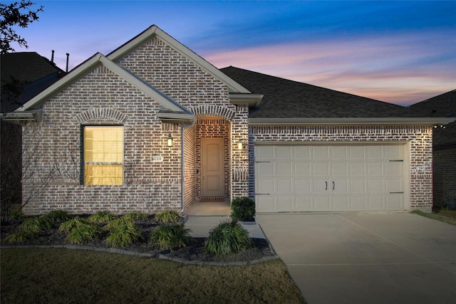 view of front of property with a garage