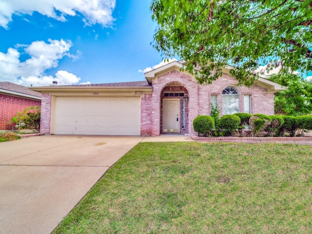 ranch-style house with a garage and a front yard