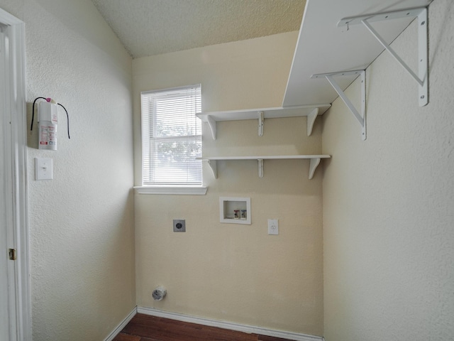 laundry area with electric dryer hookup, hookup for a washing machine, and dark hardwood / wood-style floors