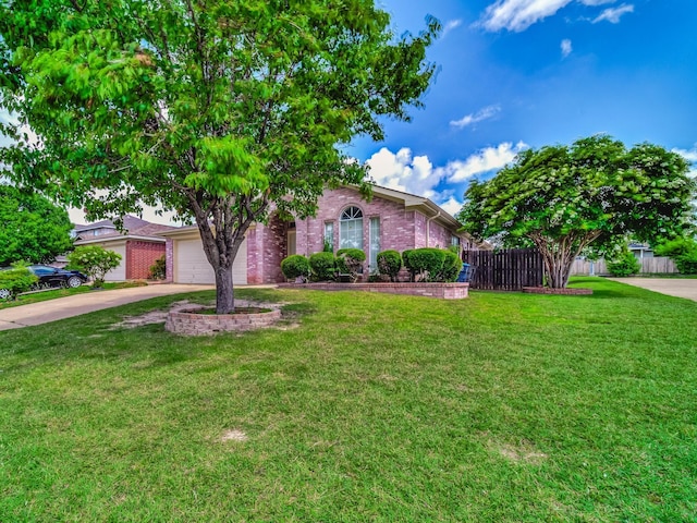 view of front of property with a front lawn and a garage