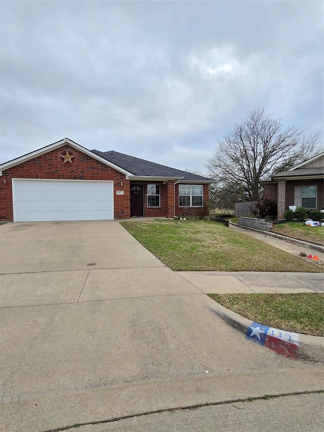 view of front facade with a garage and a front yard