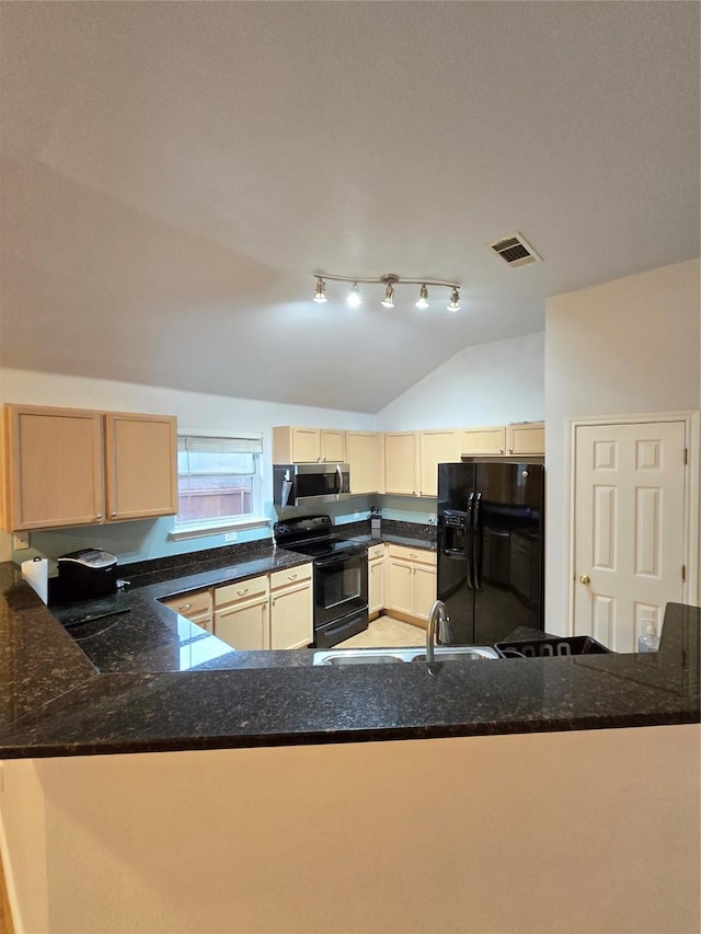 kitchen featuring sink, black appliances, light brown cabinetry, vaulted ceiling, and kitchen peninsula